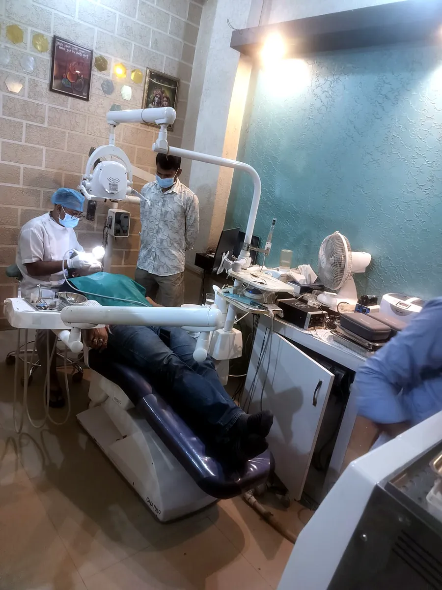 Dr. Rohit Kumar examining a patient in the treatment room